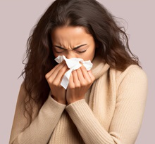 Woman sneezing